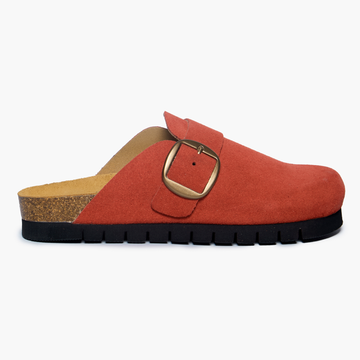 Terracota suede clog shoe with a buckle-up closure, adjustable strap, a flat cork insole and 15 mm heel height EVA outsole on a white background. Handmade in Spain
